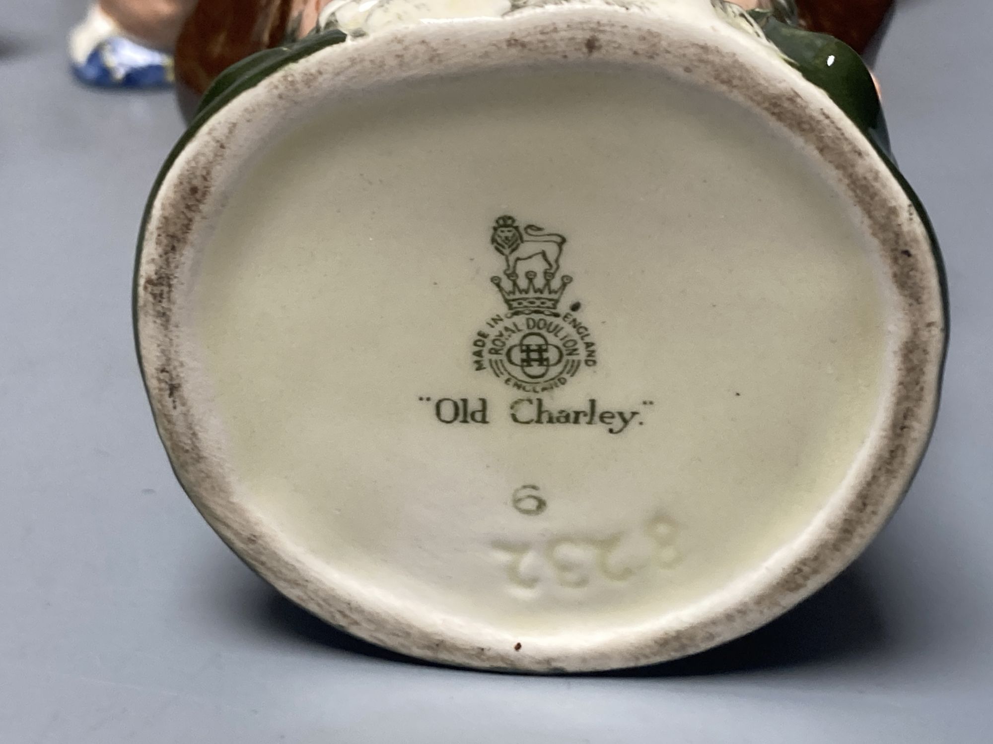 A collection of ten Royal Doulton character Tinies and miniature jugs, a small character ashtray and another similar jug